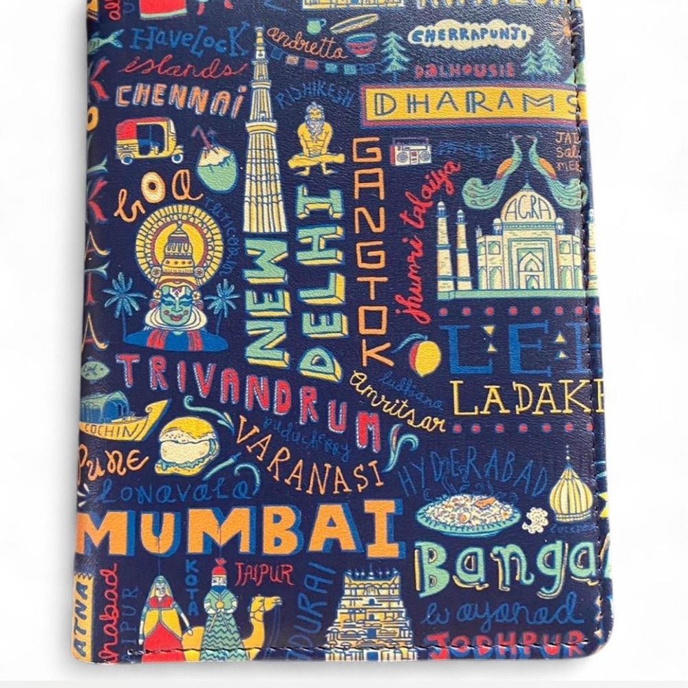 CHUMBAK Blue and multi-colored travel/passport wallet. Like new, no wear.